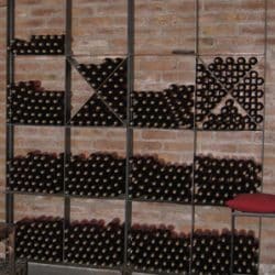 2 free standing wine racks with wine
